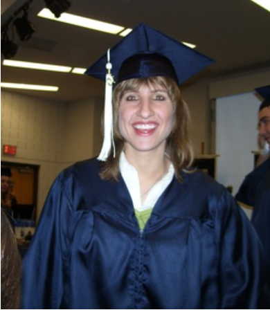 April M. Meyer in her cap and gown after graduation.